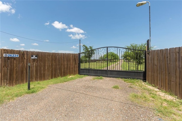 view of gate with fence