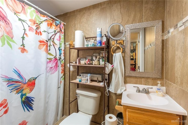 bathroom featuring vanity, toilet, and a shower with curtain