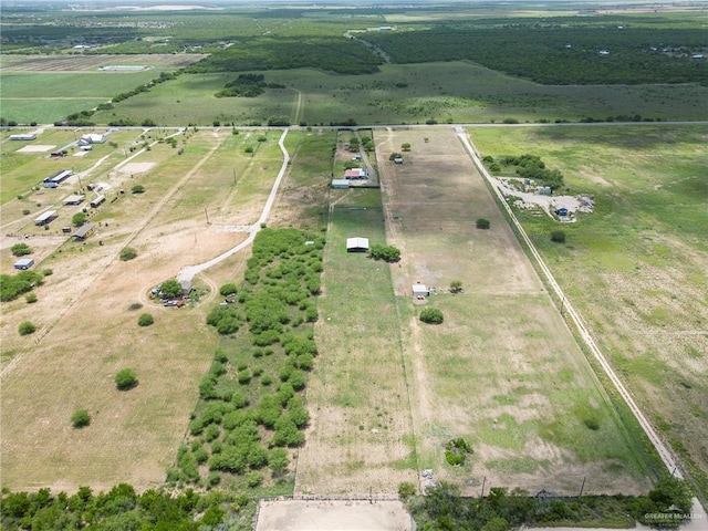 birds eye view of property with a rural view