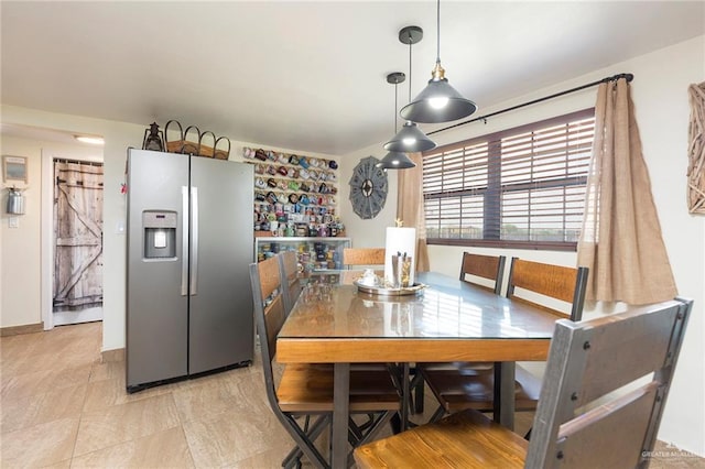 dining area featuring baseboards