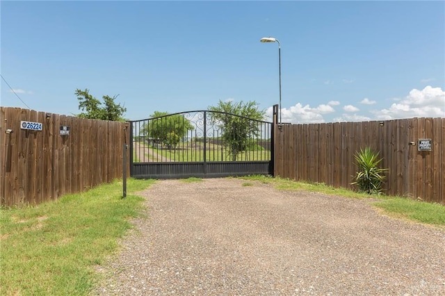 view of gate featuring fence