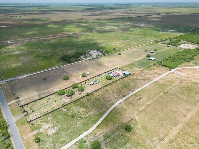 birds eye view of property with a rural view