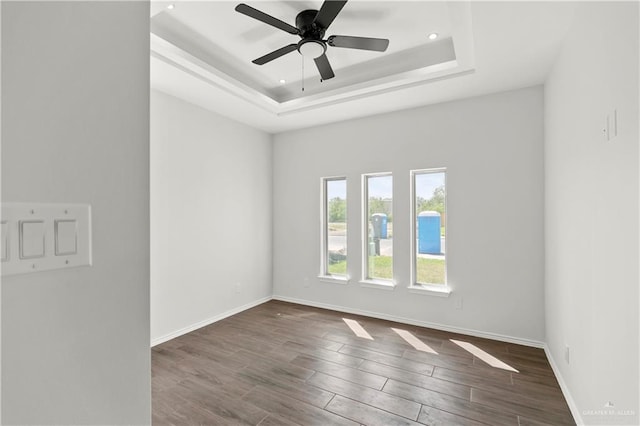 4216 Xenops Ave, Mcallen, TX 78504 - spare room featuring dark wood-style floors, ceiling fan, a raised ceiling, recessed lighting, and baseboards