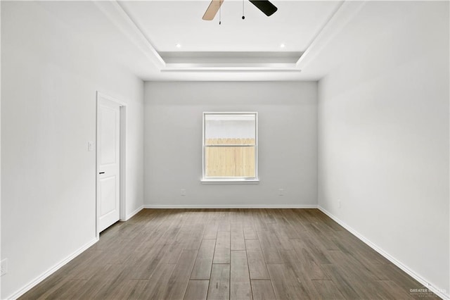 4216 Xenops Ave, Mcallen, TX 78504 - unfurnished room featuring a raised ceiling, a ceiling fan, wood finished floors, and baseboards