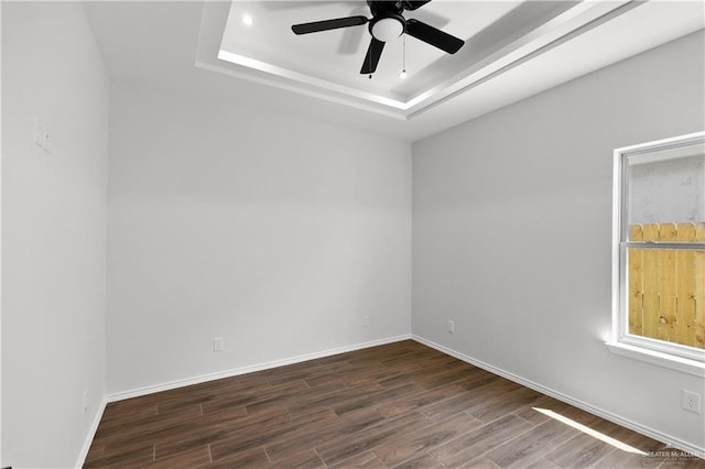 4216 Xenops Ave, Mcallen, TX 78504 - spare room with a raised ceiling, dark wood-style flooring, ceiling fan, baseboards, and recessed lighting