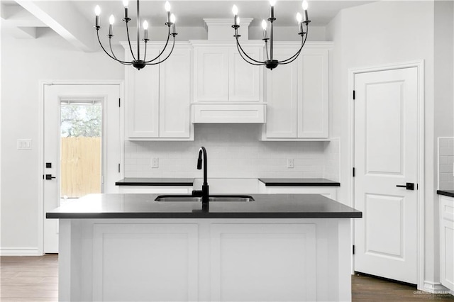 4216 Xenops Ave, Mcallen, TX 78504 - kitchen with a sink, dark countertops, tasteful backsplash, and white cabinets