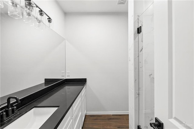 4216 Xenops Ave, Mcallen, TX 78504 - full bathroom with vanity, wood finished floors, and a shower