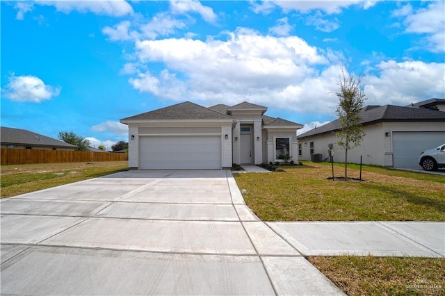 view of front of home with a front yard and a garage