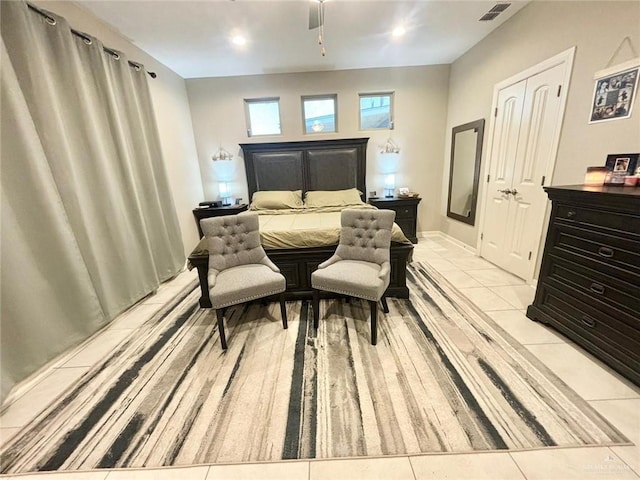 bedroom featuring ceiling fan and light tile patterned flooring