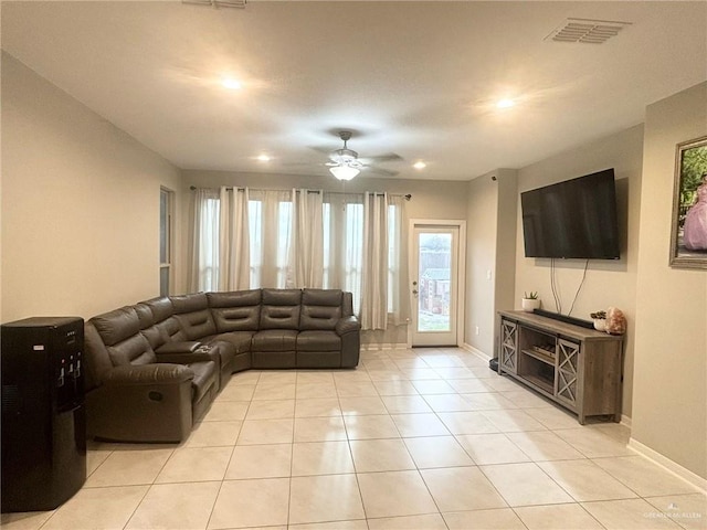 living room with ceiling fan and light tile patterned floors