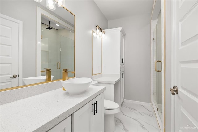 bathroom featuring vanity and an enclosed shower