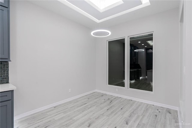 unfurnished room with light wood-type flooring