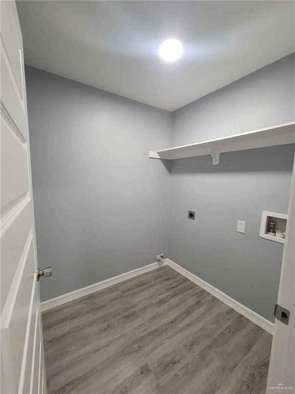 laundry area featuring hookup for a washing machine, electric dryer hookup, and hardwood / wood-style flooring