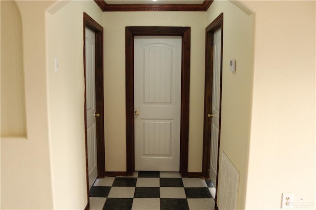 hallway featuring ornamental molding