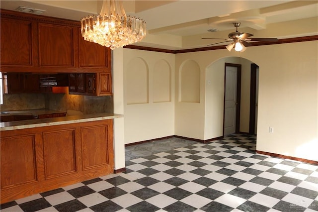 kitchen with decorative light fixtures, decorative backsplash, extractor fan, and ceiling fan with notable chandelier