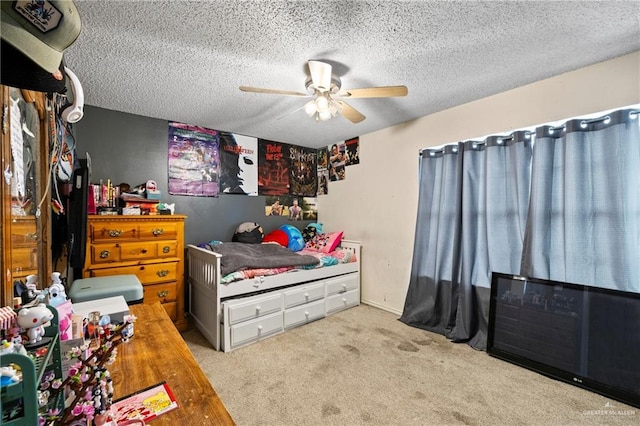 1729 W Jefferson St, Weslaco, TX 78599 - carpeted bedroom featuring a textured ceiling and ceiling fan