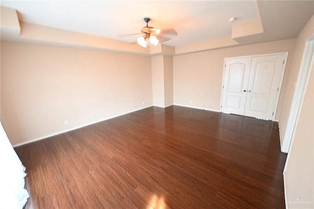 2316 Fairmont Ave, Mcallen, TX 78504 - unfurnished room with ceiling fan, dark wood-style floors, and a tray ceiling