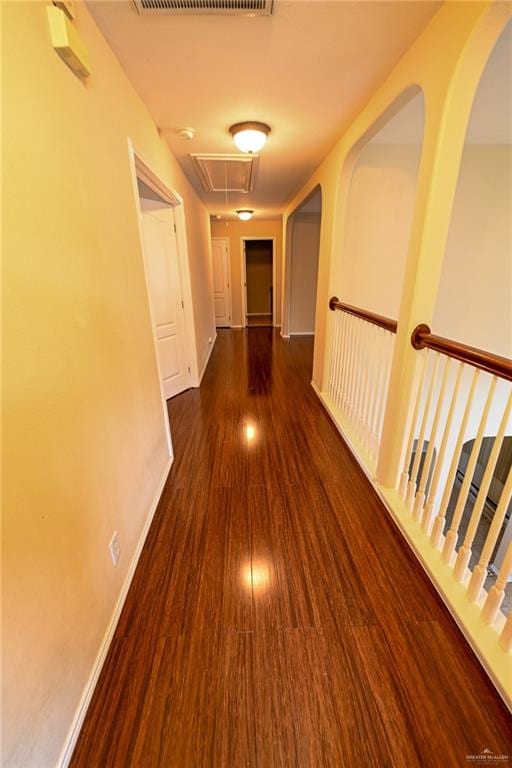 hallway with dark hardwood / wood-style flooring