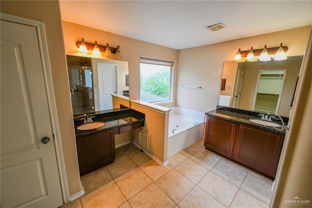 bathroom with vanity, tile patterned floors, and independent shower and bath