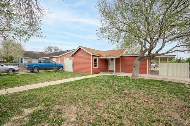 single story home featuring fence and a front lawn