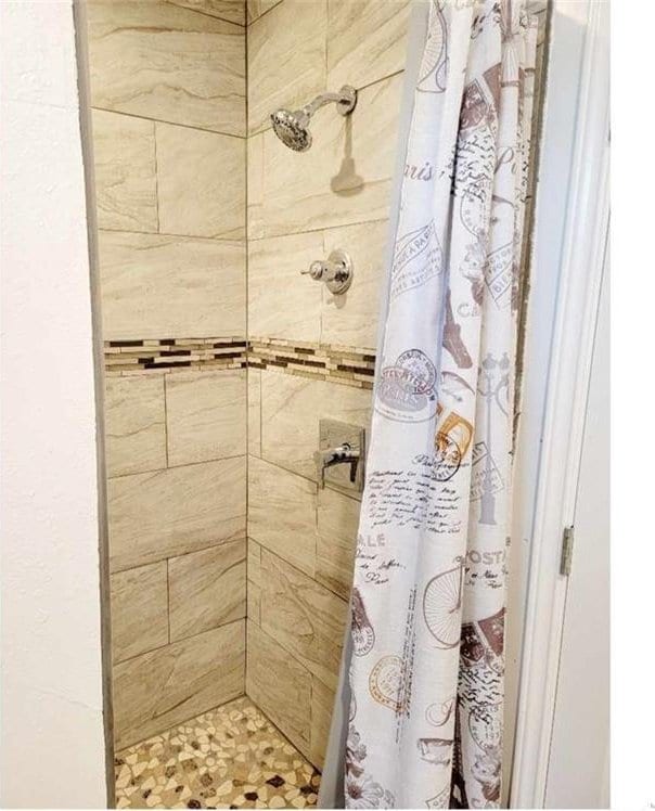 bathroom featuring walk in shower