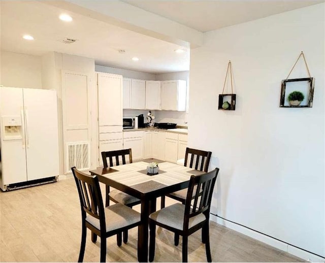 dining room with light hardwood / wood-style flooring