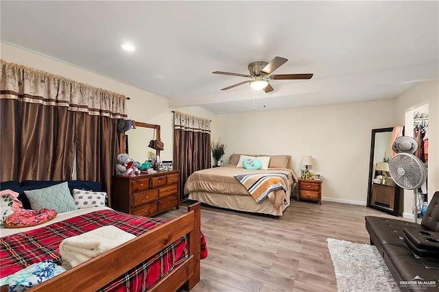 bedroom featuring ceiling fan and light wood-type flooring