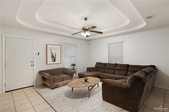 1609 Nassau St, Edinburg, TX 78541 - living area featuring a raised ceiling, light tile patterned floors, ceiling fan, and baseboards