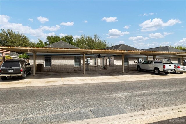 1609 Nassau St, Edinburg, TX 78541 - view of front facade featuring brick siding and covered parking