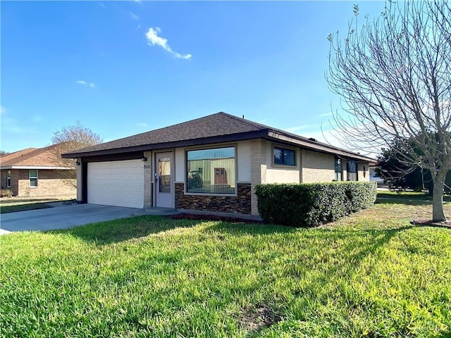 view of front of property with a garage and a front yard