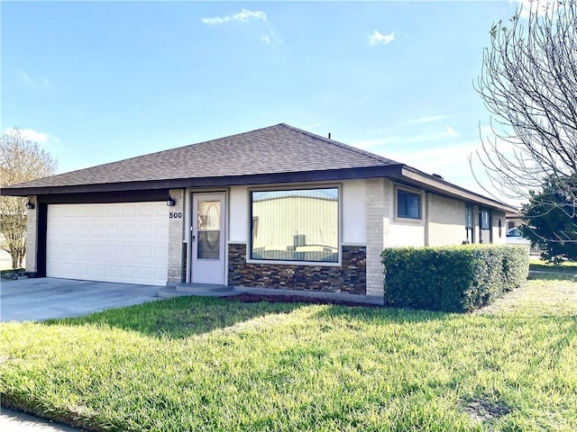 view of front facade with a garage and a front lawn