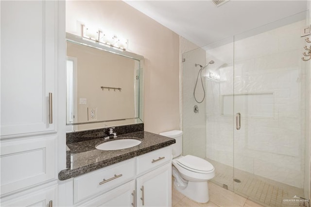 bathroom featuring walk in shower, tile patterned floors, vanity, and toilet