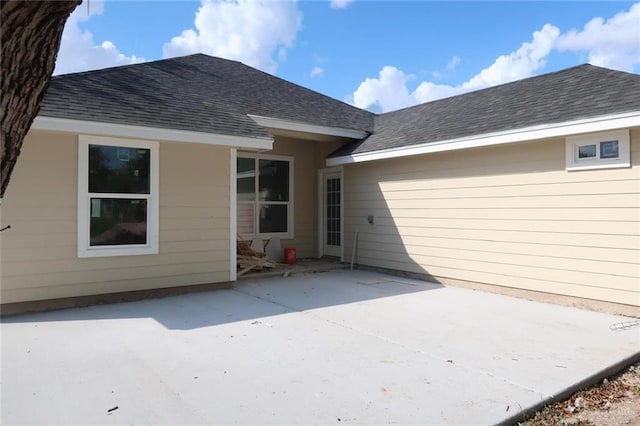 rear view of property featuring a patio area