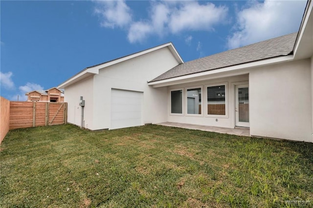 809 Azalea St, Mission, TX 78573 - back of house with a garage, stucco siding, a shingled roof, and a patio area