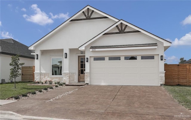 809 Azalea St, Mission, TX 78573 - view of front facade featuring driveway, stone siding, stucco siding, and an attached garage