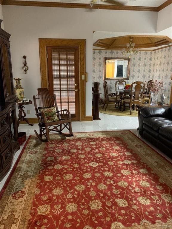 living room featuring a chandelier, light tile patterned floors, and crown molding