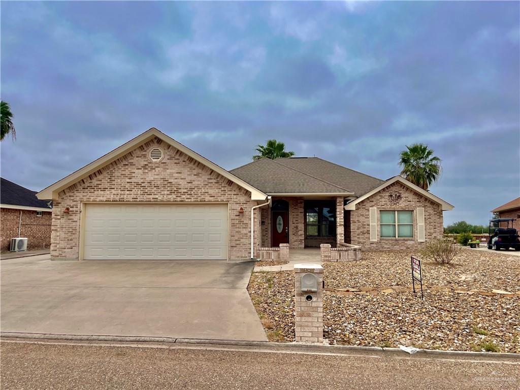 ranch-style home featuring a garage