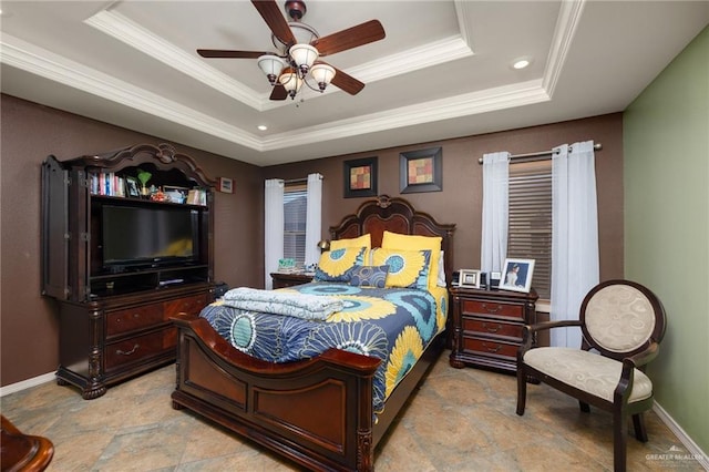 bedroom featuring a raised ceiling, ceiling fan, and crown molding