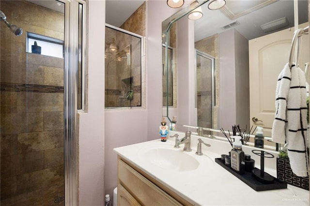 bathroom featuring vanity and a shower with shower door