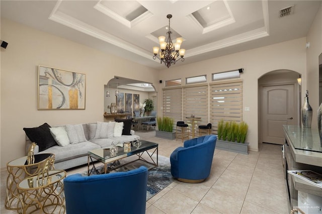 tiled living room featuring an inviting chandelier