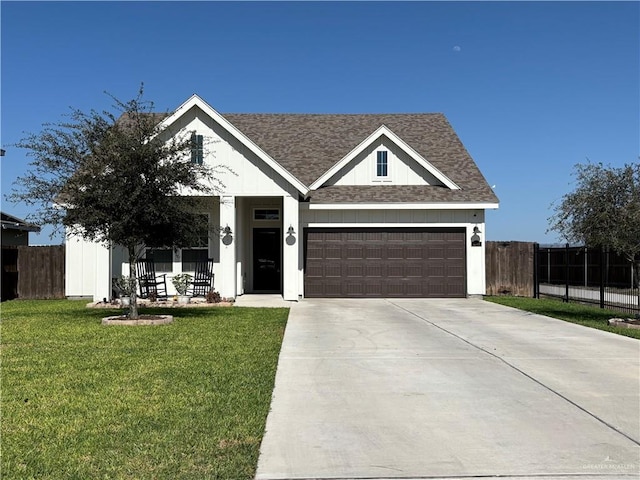 ranch-style house with driveway, roof with shingles, a front yard, and fence