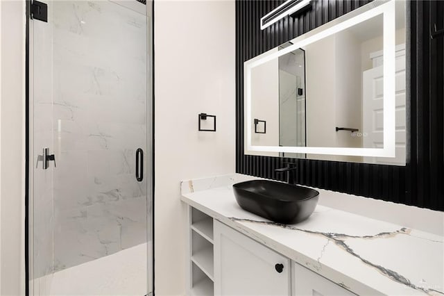 bathroom with vanity and an enclosed shower