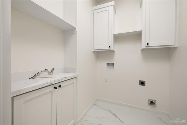 clothes washing area with hookup for an electric dryer, cabinets, and hookup for a washing machine