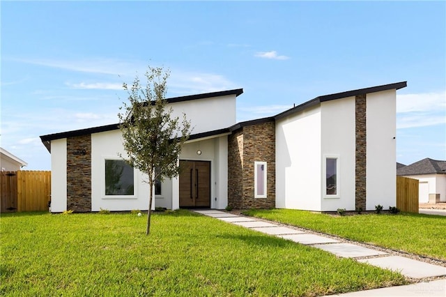 view of front of property with a front lawn