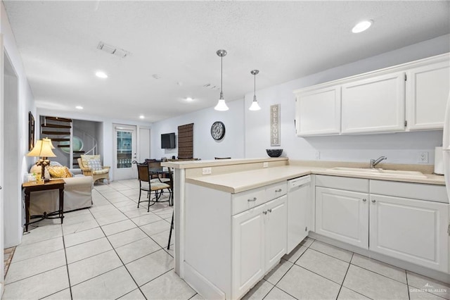 6300 Padre Blvd Unit 871, South Padre Island, TX 78597 - kitchen with open floor plan, a peninsula, light countertops, white cabinetry, and light tile patterned flooring