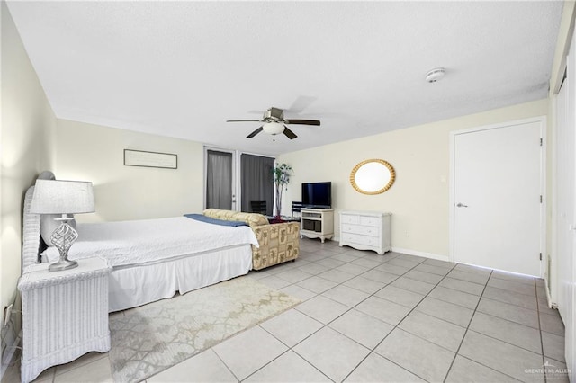 6300 Padre Blvd Unit 871, South Padre Island, TX 78597 - tiled bedroom with ceiling fan and baseboards