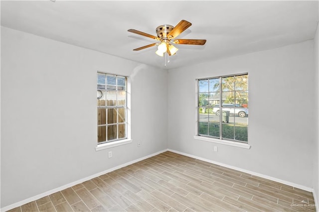 spare room with ceiling fan and light hardwood / wood-style floors