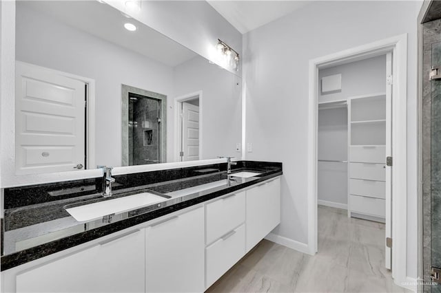 bathroom featuring vanity and walk in shower