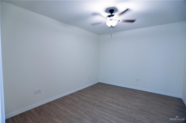 empty room featuring dark hardwood / wood-style floors and ceiling fan