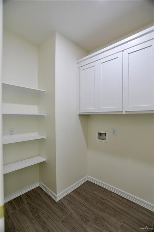 laundry room with cabinets, washer hookup, and dark wood-type flooring